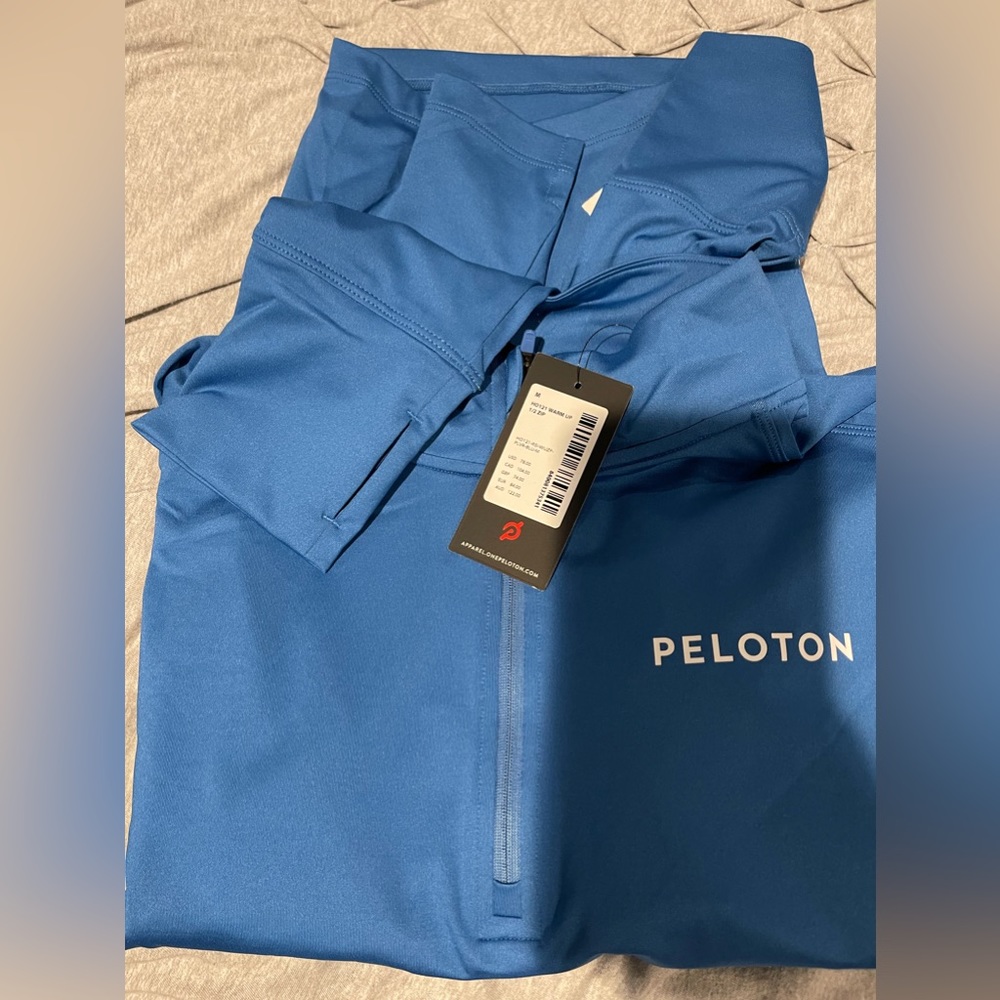 Used once -Men’s NWT Peloton large 1/2 zip pull over
